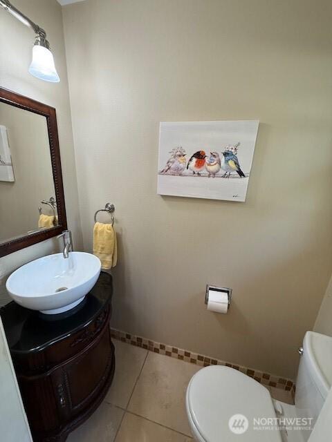 39418 200th Ave SE, Auburn, WA 98092 - half bath with toilet, vanity, tile patterned flooring, and baseboards