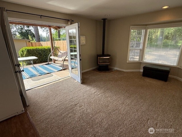 39418 200th Ave SE, Auburn, WA 98092 - doorway with plenty of natural light, a wood stove, and baseboards