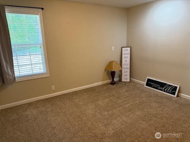 39418 200th Ave SE, Auburn, WA 98092 - empty room with healthy amount of natural light, carpet flooring, and baseboards