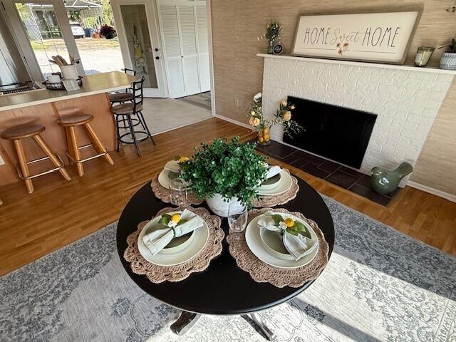 39418 200th Ave SE, Auburn, WA 98092 - living area featuring wood finished floors, baseboards, and a fireplace