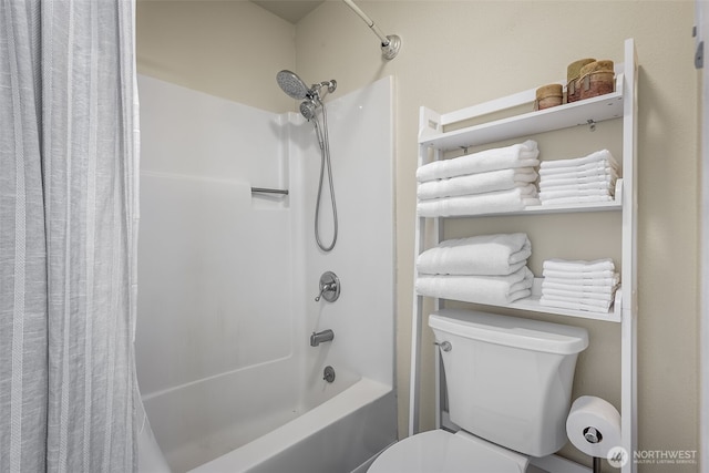 full bath featuring toilet and shower / bath combination with curtain