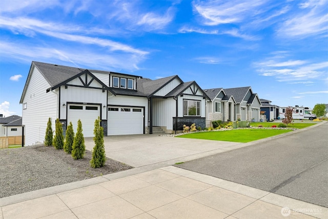 5411 Lonicera Dr, Blaine, WA 98230 - tudor home featuring a residential view, board and batten siding, driveway, a front yard, and a garage