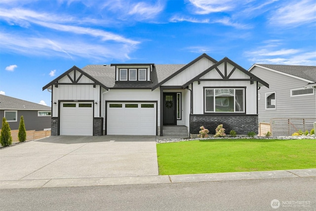 5411 Lonicera Dr, Blaine, WA 98230 - view of front facade featuring driveway, roof with shingles, board and batten siding, and a garage