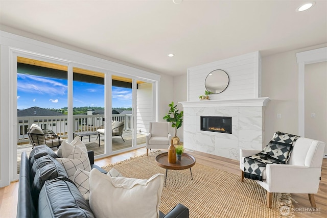 5411 Lonicera Dr, Blaine, WA 98230 - living room with a high end fireplace, wood finished floors, and recessed lighting