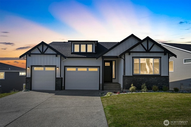 5411 Lonicera Dr, Blaine, WA 98230 - view of front of home featuring concrete driveway, a lawn, a shingled roof, brick siding, and an attached garage