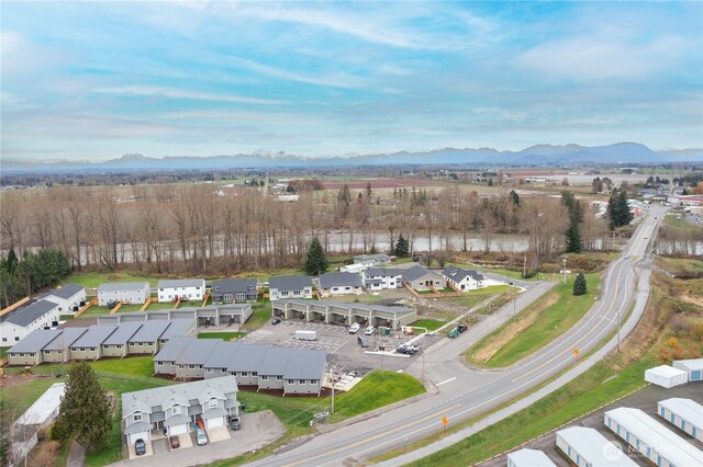 aerial overview of property's location with mountains and nearby suburban area