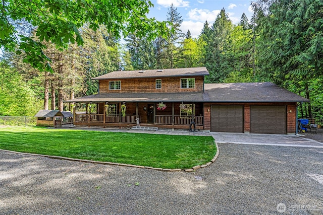 161 Mill Creek Rd, Longview, WA 98632 - view of front of property with an attached garage, covered porch, driveway, and a storage unit