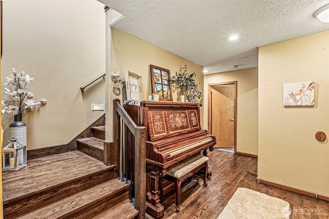 161 Mill Creek Rd, Longview, WA 98632 - stairs with wood finished floors, baseboards, and a textured ceiling