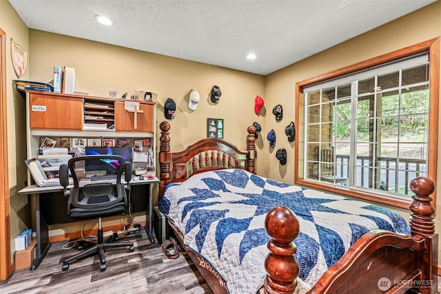 161 Mill Creek Rd, Longview, WA 98632 - bedroom with wood finished floors, recessed lighting, a textured ceiling, and a desk