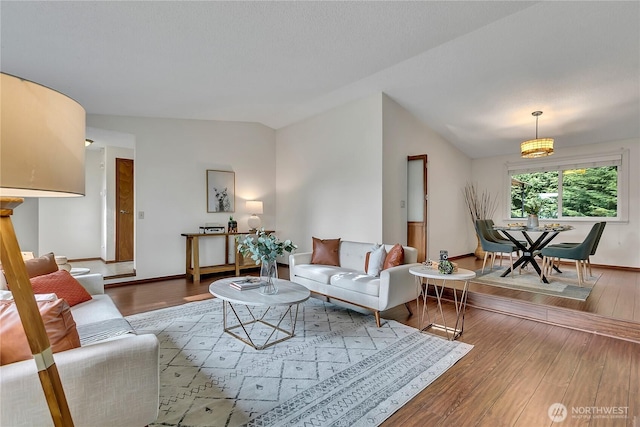 living room with wood finished floors and baseboards