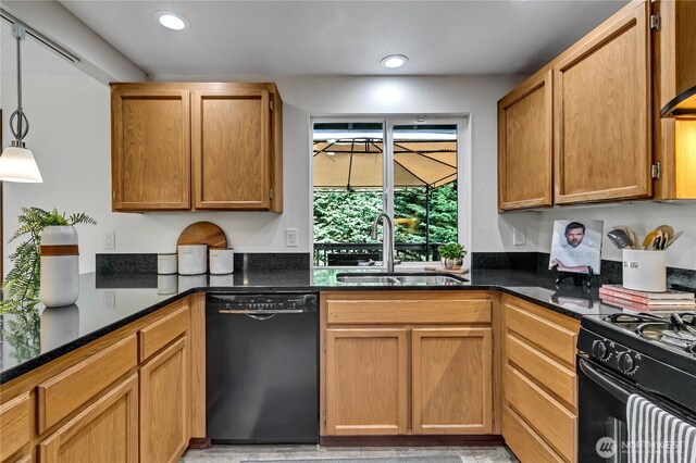 kitchen with black appliances, a sink, recessed lighting, dark stone countertops, and hanging light fixtures