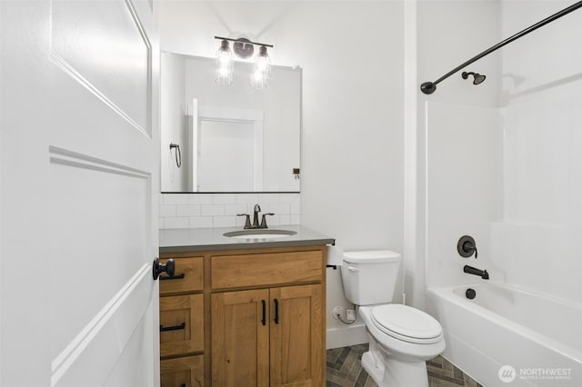 full bathroom with toilet, tasteful backsplash, vanity, bathtub / shower combination, and baseboards