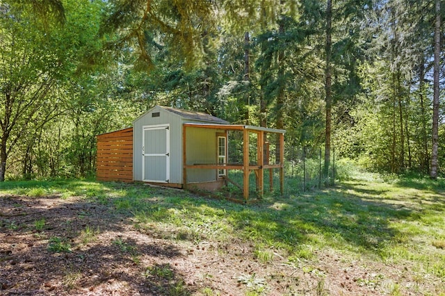 view of shed featuring a forest view