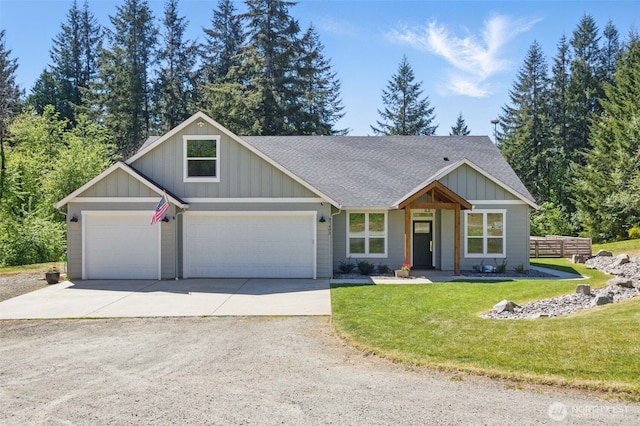 view of front of home with board and batten siding, concrete driveway, roof with shingles, and a front lawn