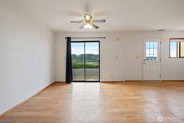 1038 Fairmount Ave, Shelton, WA 98584 - spare room with ceiling fan, light wood-style floors, and baseboards