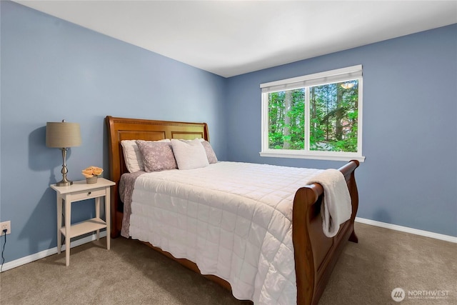 bedroom with carpet floors and baseboards