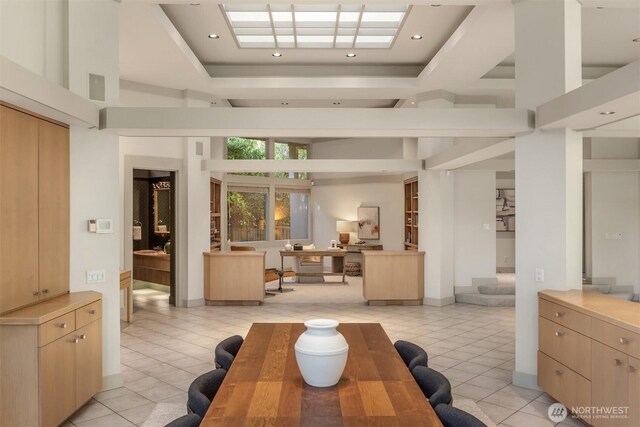 common area with recessed lighting, stairs, and a high ceiling