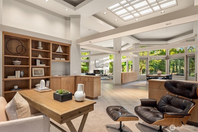 home office with recessed lighting, a high ceiling, and light tile patterned floors