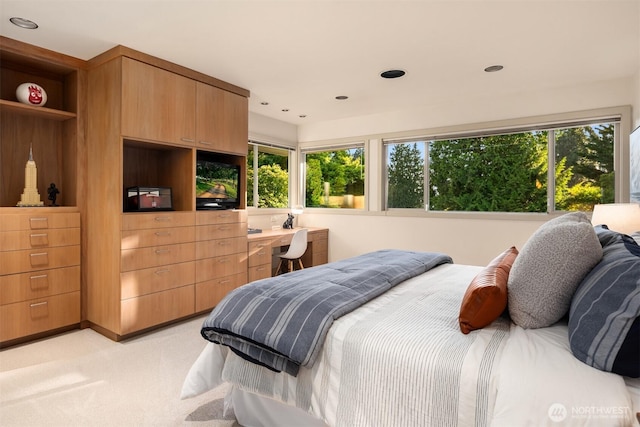 bedroom featuring light carpet