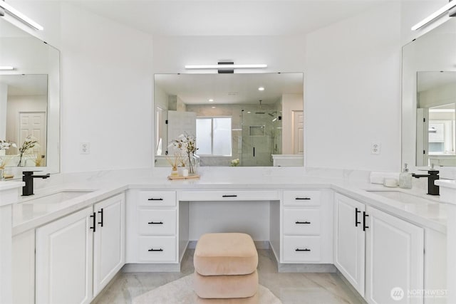 full bathroom with a stall shower, vanity, and marble finish flooring