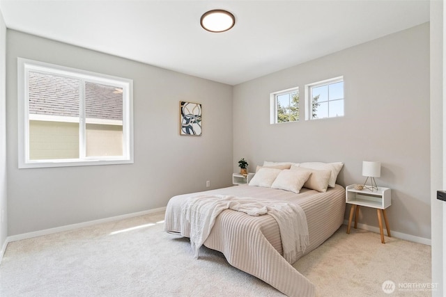 bedroom with carpet floors and baseboards
