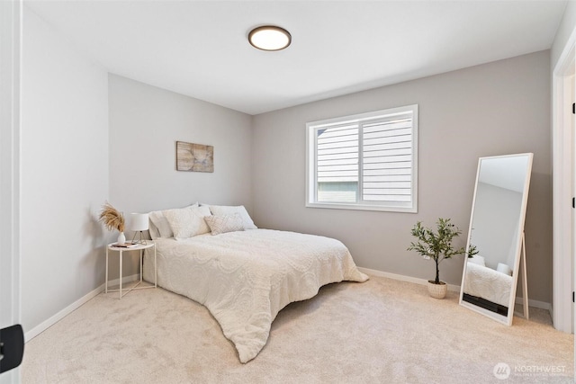 bedroom with carpet flooring and baseboards