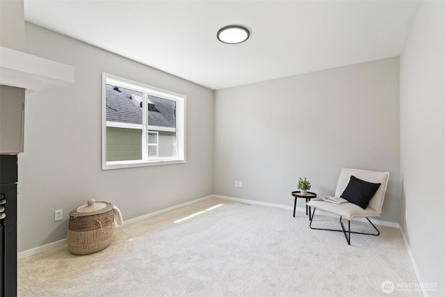 unfurnished room with carpet flooring and baseboards