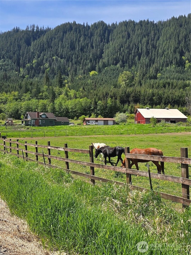 121 Temple Rd, Morton, WA 98356 - surrounding community featuring a wooded view, a rural view, and an outbuilding