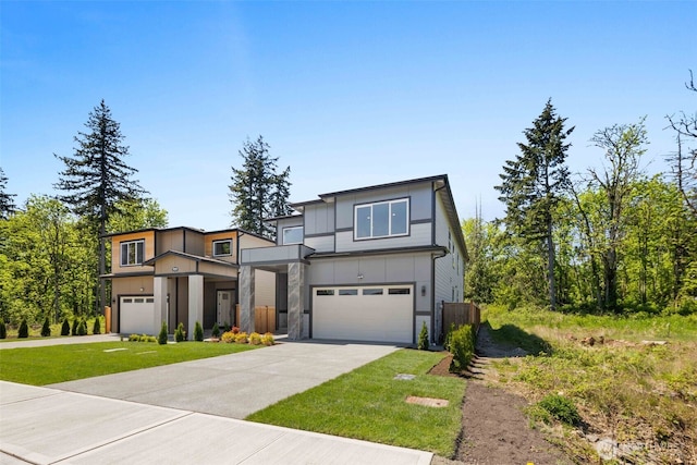 view of front of property featuring a garage, concrete driveway, stone siding, and board and batten siding