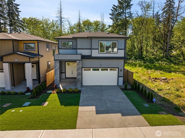 view of front facade featuring a garage, driveway, and a shingled roof