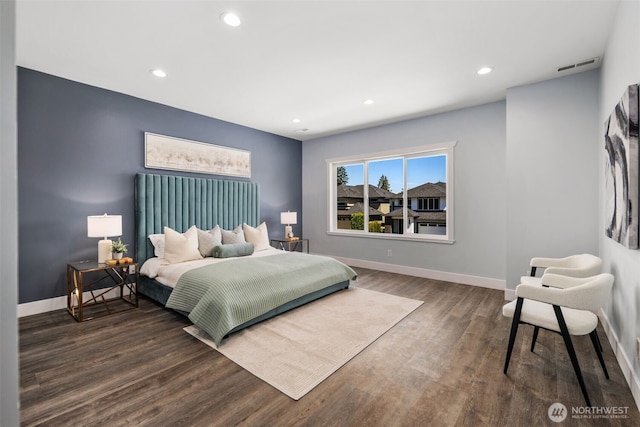 bedroom with wood finished floors, baseboards, and recessed lighting