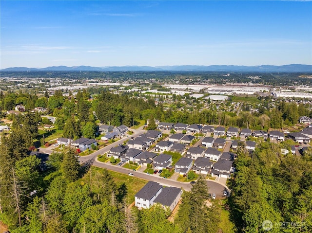 view of property location featuring a mountainous background and nearby suburban area