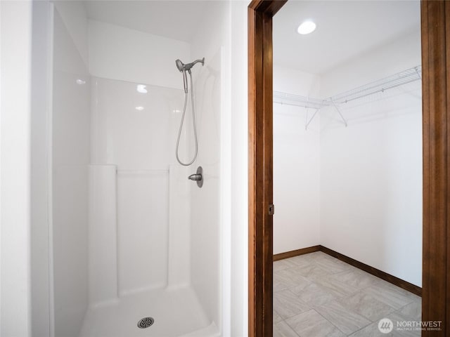 23201 Rd 12 NW, Quincy, WA 98848 - bathroom featuring a shower, a spacious closet, and baseboards