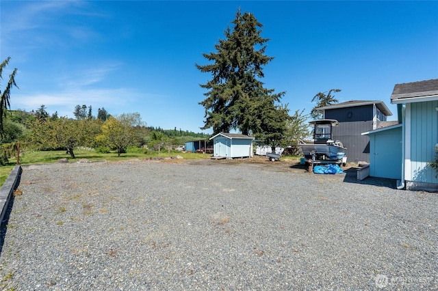 130 Priest Point Dr NE, Tulalip, WA 98271 - view of yard with a storage shed and an outdoor structure