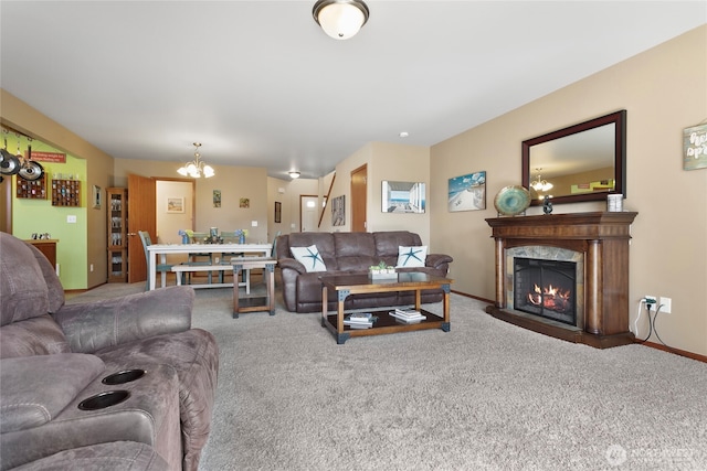 carpeted living room with a chandelier, a high end fireplace, and baseboards