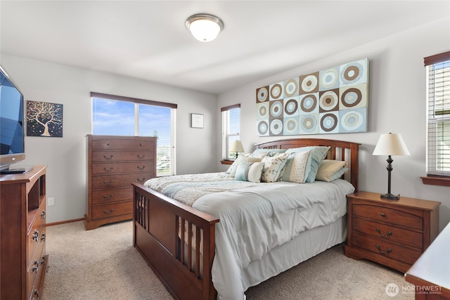 bedroom featuring light carpet