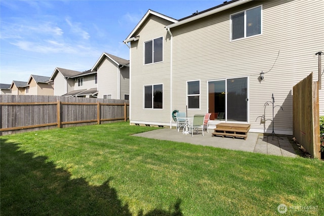rear view of house featuring a patio, entry steps, and a residential view