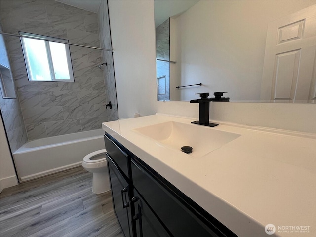 2802 Sumner Ave, Hoquiam, WA 98550 - full bath with toilet, shower / bathtub combination, vanity, and wood finished floors