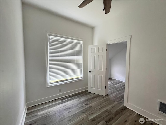 2802 Sumner Ave, Hoquiam, WA 98550 - spare room with baseboards, a ceiling fan, visible vents, and dark wood-type flooring