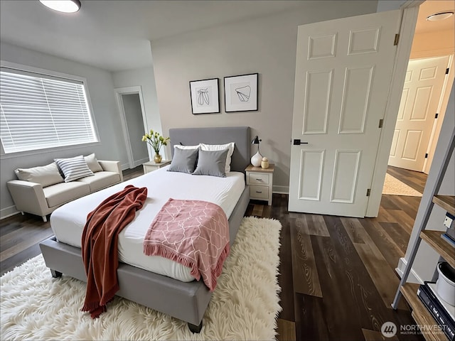 2802 Sumner Ave, Hoquiam, WA 98550 - bedroom featuring baseboards and dark wood-style floors