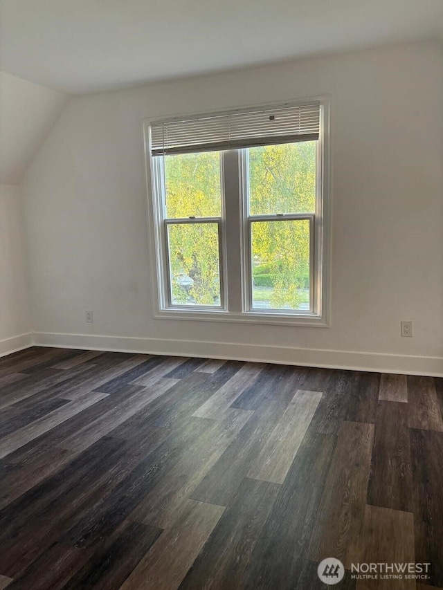 2802 Sumner Ave, Hoquiam, WA 98550 - bonus room featuring a wealth of natural light, dark wood finished floors, vaulted ceiling, and baseboards