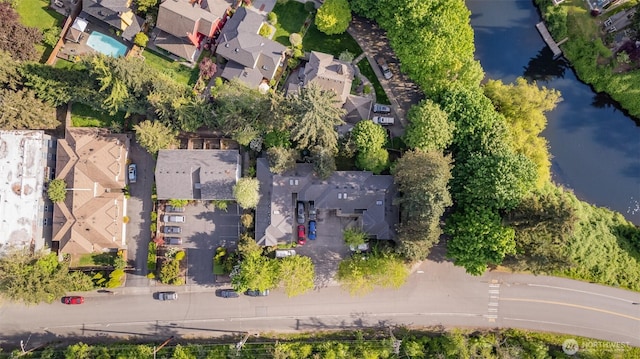 aerial perspective of suburban area with a large body of water