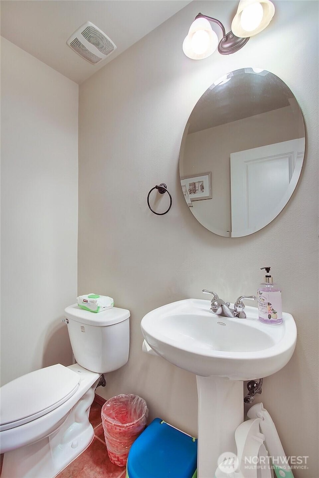 half bathroom with toilet
