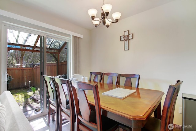 dining area featuring a chandelier