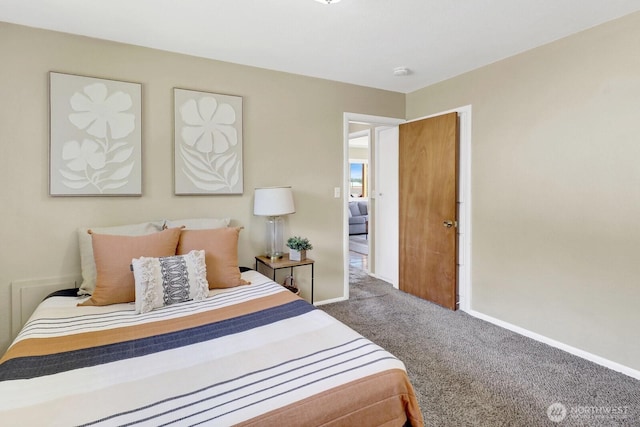 carpeted bedroom featuring baseboards