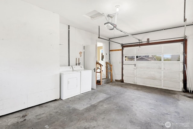 garage with washing machine and dryer and a garage door opener