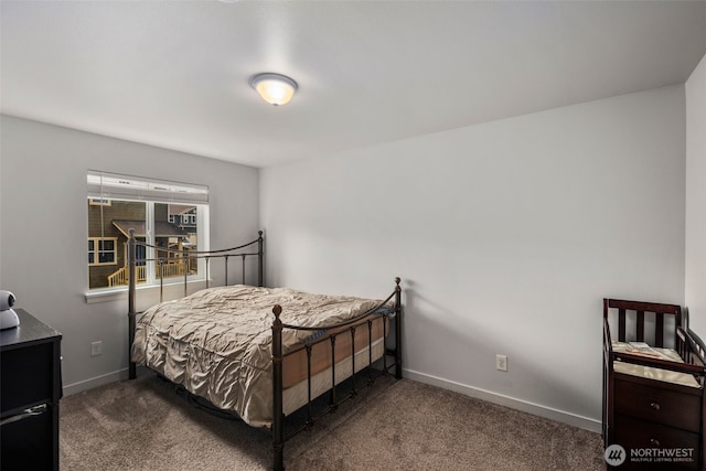 bedroom with carpet and baseboards