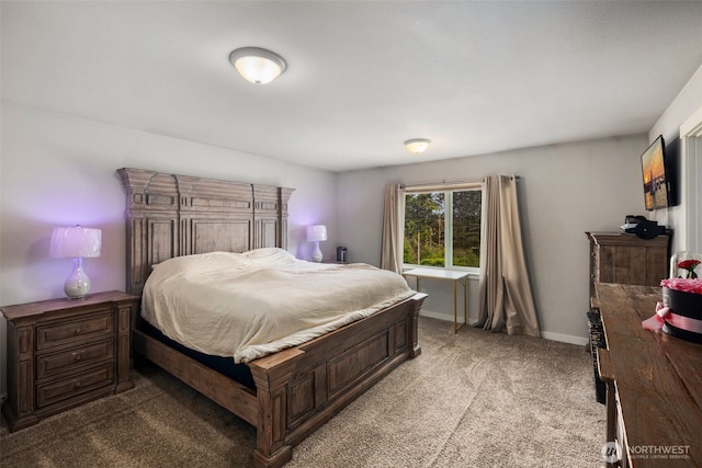 bedroom with light carpet and baseboards