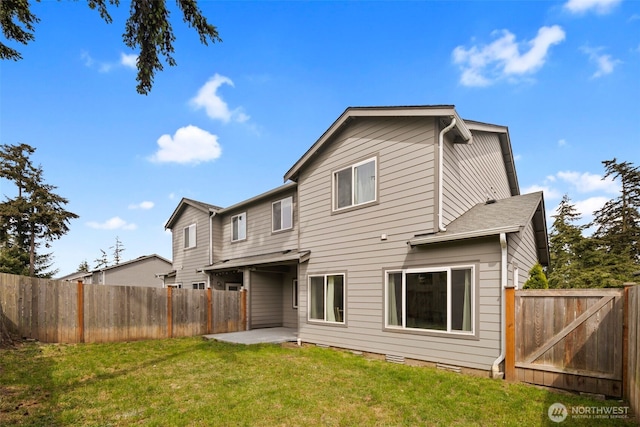 back of property with a patio area and a gate