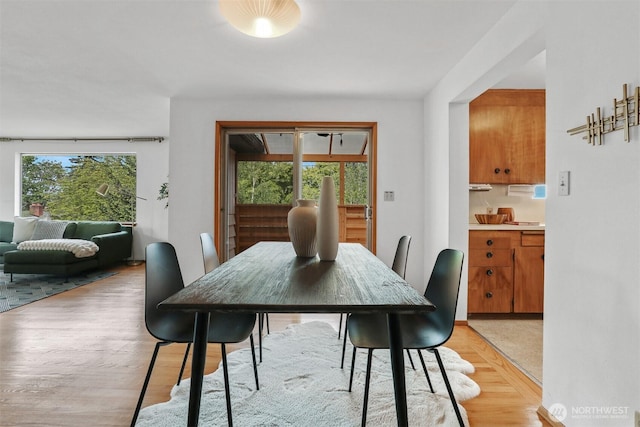 dining area with light wood-style floors